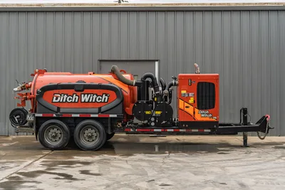 2023 Ditch Witch HX75 mud recycler, full driver-side profile, orange tank, vacuum hoses, pump module, tandem axle trailer