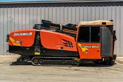 2016 Ditch Witch JT30 All Terrain HDD drill side profile, showing enclosed cab, engine housing, tracks, and drill pipe.