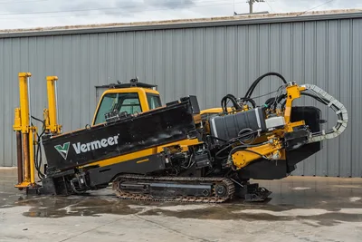 2017 Vermeer 40x55 S3 horizontal directional drill, side view showing operator cab, steel tracks, and drill pipe rack.
