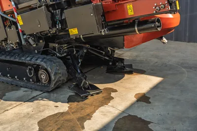 2020 Ditch Witch JT24 directional drill, low-angle side view focusing on heavy-duty rubber tracks and hydraulic stabilizers.