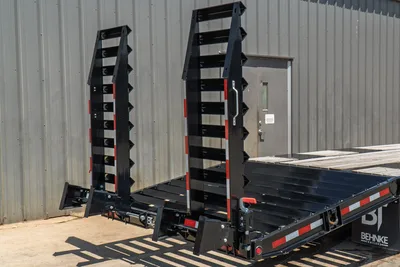 2026 Behnke FB8X30SDPT-40L folding stand-up ramps in upright position, black steel construction, red reflective tape, wood deck