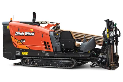2022 Ditch Witch JT10 HDD drill, side view, rubber tracks, loaded drill pipe rack, operator seat, and drill frame visible