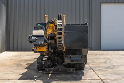 2021 Vermeer D24x40 S3 HDD drill, rear 3/4 view showing drill frame, hydraulic hoses, carriage, fluid tank, and rubber tracks