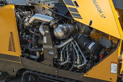 2022 Vermeer D23x30 S3 open engine compartment showing 100hp diesel engine, exhaust, hydraulic lines, and Navigator branding