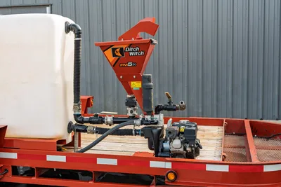 2019 Belshe WB14-2EP mud mixing system with Ditch Witch FM5x hopper, poly water tank, pump manifold, and engine on red trailer deck.