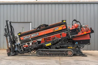 2021 Ditch Witch JT28 HDD drill, full left-side profile, elevated drill frame, rubber tracks, red spindle, hydraulic lines visible