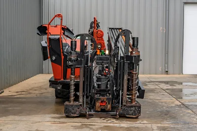 2021 Ditch Witch JT40 HDD drill, rear view showing drill frame, vise assembly, pipe rack, hydraulic lines, and operator station