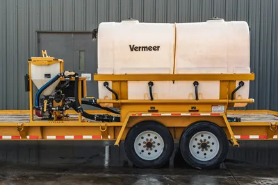 2021 TowMaster T-20D mud mixing trailer, yellow frame, Vermeer-branded poly water tank, bentonite hopper, pump assembly, dual-axle tandem wheels
