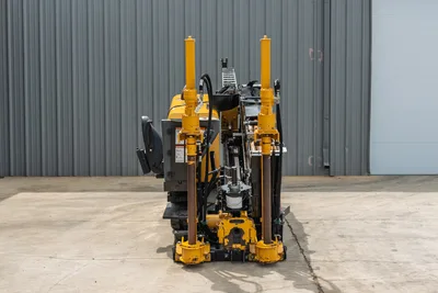 2024 Vermeer D20x22 S3 HDD drill, front view showing drill frame, anchor posts, spindle, hydraulic lines, and operator seat