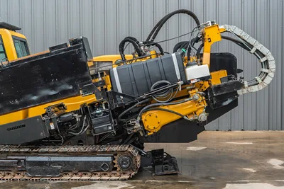 Side profile of 2017 Vermeer 40x55 S3 HDD showing steel tracks, drill rack, hydraulic hoses, and operator cab exterior.