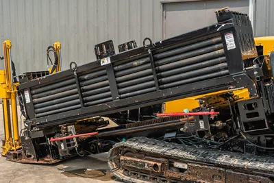 2014 Vermeer 24x40 Series II drill pipe rack and carriage assembly, side view showing tracks and drill rod storage.