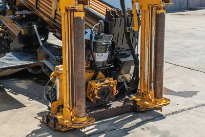 2020 Vermeer D24x40 S3 drill frame close-up showing rotary drive, vise assembly, guide columns, air filter, and loaded drill pipe rack