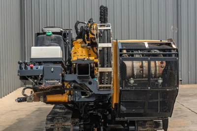Rear view of 2014 Vermeer 24x40 Series II HDD drill showing engine compartment, hydraulic hoses, and operator control panel.