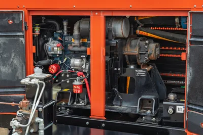 2019 Ditch Witch HX30 engine compartment showing Kubota engine, blower, alternator, and fluid filtration systems.