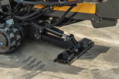 2024 Vermeer D20x22 S3 hydraulic anchor/stake system extended, close-up undercarriage view showing tire, hoses, and frame