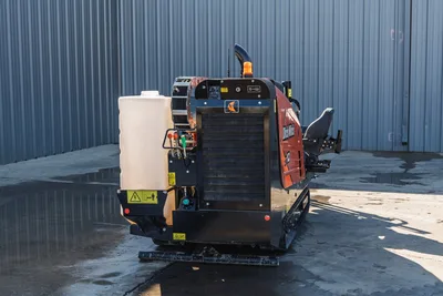 2020 Ditch Witch JT10 HDD rig with 9,000 lbs thrust, tracked carrier, engine compartment, fluid tank, and control panel visible.