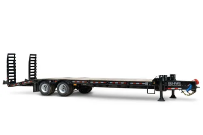 2026 Behnke FB8X30SDPT-40L flatbed equipment trailer, black steel deck, dual tandem axles, fold-up ramps, pintle hitch, side-angle view