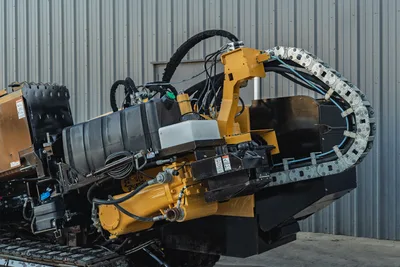 2019 Vermeer D40x55 S3 HDD drill carriage close-up showing spindle, hydraulic hoses, cable carrier, and thrust frame