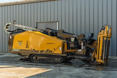 2021 Vermeer D23x30 S3 Navigator HDD rig, side view, yellow, rubber tracks, drill pipe loaded, hydraulic anchor system visible