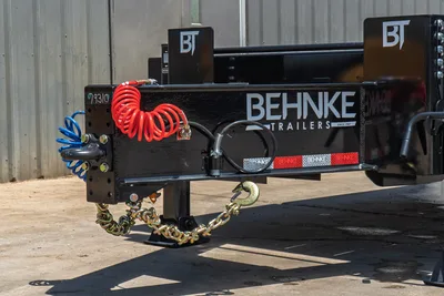 2026 Behnke FB8X30SDPT-40L trailer front coupler, safety chains, red/blue coiled air lines, jack stand, BT branding