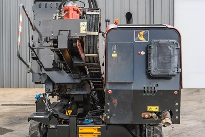 2021 Ditch Witch JT28 HDD drill, rear view showing drill carriage, hydraulic rotary head, engine enclosure, and fluid connections