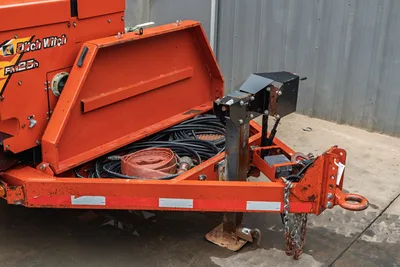 2015 Ditch Witch MR90 mud recycler trailer hitch end, open storage compartment with hydraulic hoses, layflat hose, pintle hitch, safety chains
