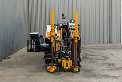 2016 Vermeer D23x30 S3 HDD drill, rear view showing anchor posts, drill frame, operator seat, tracks, and hydraulic components