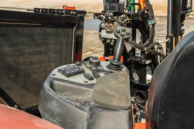 Ditch Witch JT24 operator station, joystick controls, digital display panel, and seat assembly with drill pipe rack visibility.