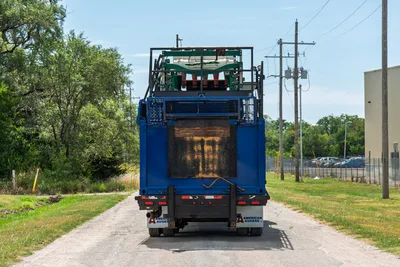 2023 American Augers M300DH mud recycler, rear view, blue truck-mounted unit with shaker deck, wear-stained rear panel, dual brand decals
