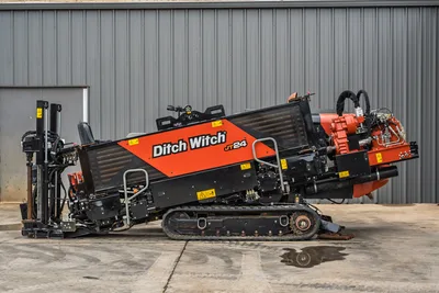 2024 Ditch Witch JT24 HDD drill, full left-side profile, rubber tracks, angled drill frame, carriage, rotary head, hydraulic lines visible