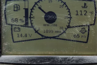 2018 Ditch Witch JT10 digital operator display showing 1899 hours, RPM, battery voltage, and hydraulic pressure readings.