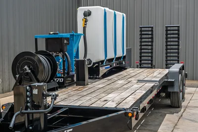 2026 Behnke CBCT2324E-BT-R trailer, 3/4 view, wood deck, SL500 mixing unit, hose reel, poly water tank, pipe racks