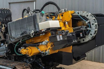 2018 Vermeer D24x40 S3 HDD rig close-up showing yellow hydraulic drive, carriage joystick, cable track, fluid reservoirs, and rubber tracks