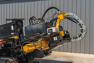 2019 Vermeer D40x55 S3 HDD drill carriage close-up showing thrust frame, cable track, hydraulic hoses, and Navigator Freeze Guard fluid tank