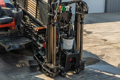 2020 Ditch Witch JT24 drill rig, close-up of pipe rack, stabilizers, and operator station. Well-maintained HDD equipment.