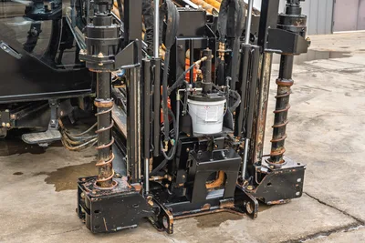 Close-up of 2021 Ditch Witch AT40 All Terrain anchoring system, hydraulic stabilizers, heavy-duty frame, and drill setup.