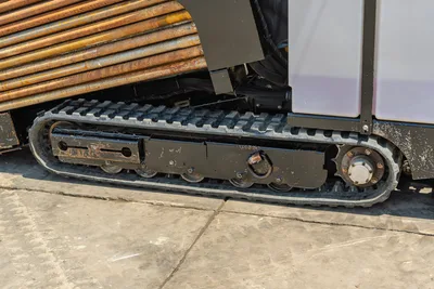 Vermeer 10x15 S3 rubber track undercarriage with drill pipe storage rack and drilling equipment mounted above, side profile view