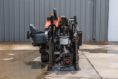 2018 Ditch Witch JT10 HDD drill, rear view showing drill frame, hydraulic system, operator seat, rubber tracks, red engine hood