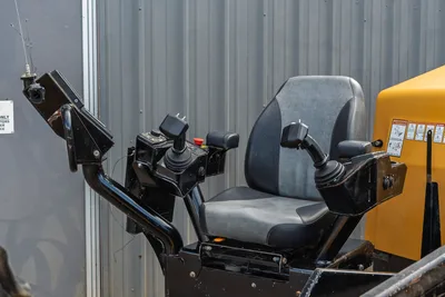 2018 Vermeer D24x40 S3 operator seat with dual joystick controls, armrests, and locator antenna mount, close-up view