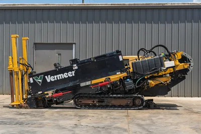 2021 Vermeer D24x40 S3 HDD drill, full left-side profile, rubber tracks, drill frame angled, pipe loader visible, hydraulic hoses exposed