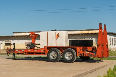 2016 Belshe WB14-2EP trailer with Ditch Witch FM5x mixing system, side view, on concrete.