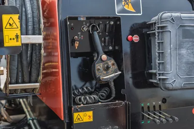 2021 Ditch Witch JT25 operator station, showing drill remote control, ignition key, emergency stop, and hydraulic controls.