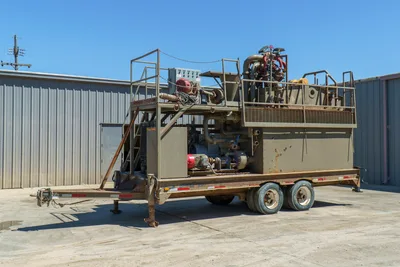 2018 Vermeer MCT-450 mud recycler on tandem-axle trailer, side-angle view, shaker deck, pumps, piping, control panel, access stairs visible