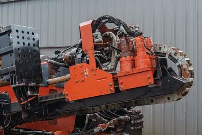 2008 Ditch Witch JT4020 MACH 1 carriage, rotation motors, and drill pipe assembly, side view showing hydraulic components.