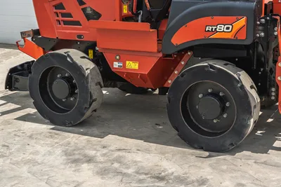 2017 Ditch Witch RT80 utility tractor side profile showing heavy-duty tires, chassis, and engine compartment branding.