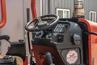 2017 Ditch Witch RT80 operator station, steering wheel, control console, and exhaust stack in good, clean condition.