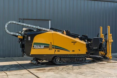2016 Vermeer D23x30 S3 HDD drill, driver-side profile, yellow hood, rubber tracks, drill frame, pipe loader arm visible