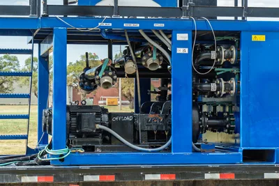 American Augers M300DH mud recycler pump bay showing offload motor, MCM pump, manifold plumbing, mud/water inlet ports on blue steel frame