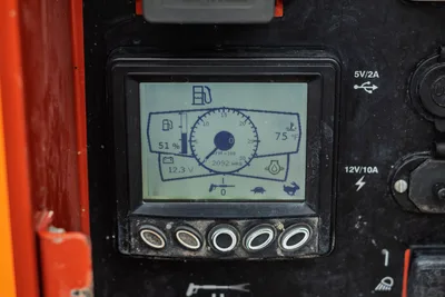 Ditch Witch HX50 digital display panel showing 2,092 hrs, 51% fuel, 12.3V battery, 75°F temp with USB and 12V ports visible