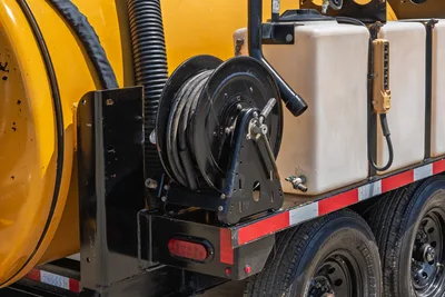 Vermeer LP873SDT vacuum excavator trailer-mounted hose reel, white water tank, corrugated suction hose, dual axle, red reflective markings